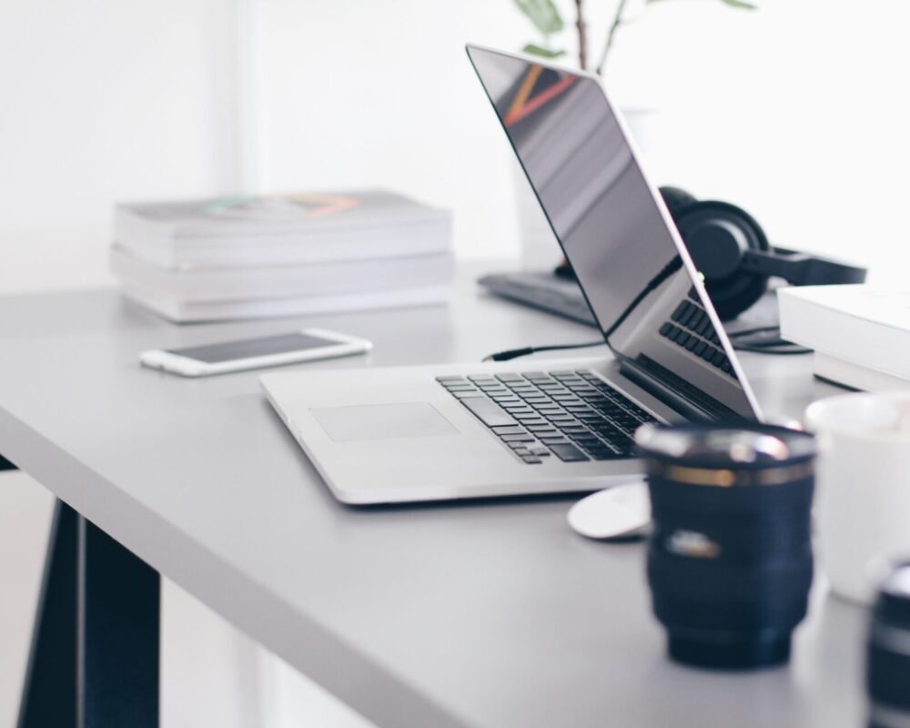 A laptop on top of work station